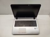 a laptop computer sitting on top of a white table