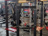 a gym with a lot of equipment in the room