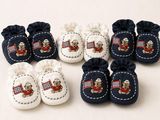 a group of baby shoes with teddy bears on them
