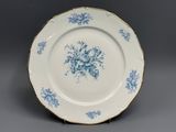 an image of a blue and white plate with flowers on it