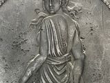 an image of a silver coin with a woman on it