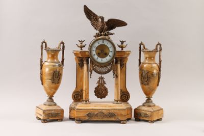 three vases and a clock with an eagle on top