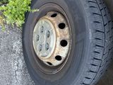a tire that is sitting on the side of the road