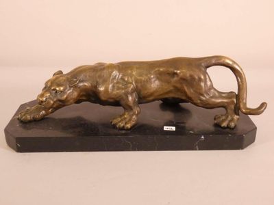 statue of a lion on a marble base on a white background