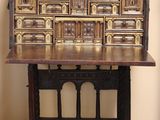 an old wooden desk with a drawer on it