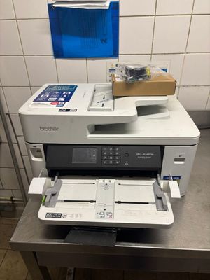 a printer that is sitting on top of a table