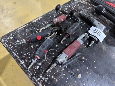 a lot of tools that are sitting on a table