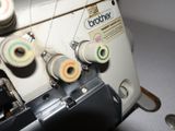 a close up of a sewing machine on a table