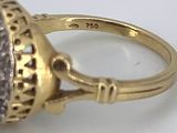 an image of a gold ring with a stone in the center