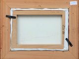 an image of a picture frame with a piece of paper taped to it