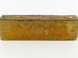 an antique brass box with a blue stone in the top