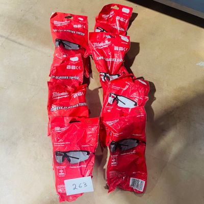 six pairs of sunglasses on the floor of a store