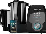 an image of a black and silver blender with a cell phone next to it