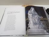 an open book with a picture of a statue on it