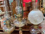 a lot of glass lamps on a table in a room