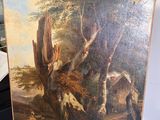 un tableau posé sur un chevalet, avec, en arrière-plan, un tableau représentant un cerf