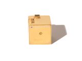 an image of a small gold box on a white surface