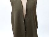 the vest is made of linen and has buttons on the front