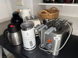 a blender and a toaster on a counter in a kitchen