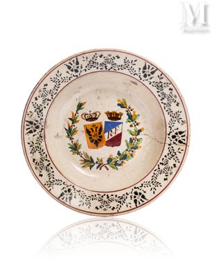 a small plate with a coat of arms on it