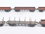 four train cars that are lined up on a white surface