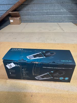 the box of a hair dryer is sitting on the floor