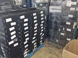many boxes that are stacked up in the warehouse