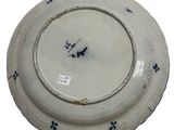 a white plate with a blue design on it