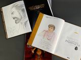 three books that are sitting on a table