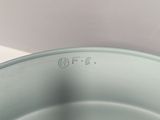 a close up of a metal pan with a lid