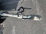 a bike that is parked on the street in the parking lot