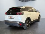 the rear end of a white suv parked in a garage