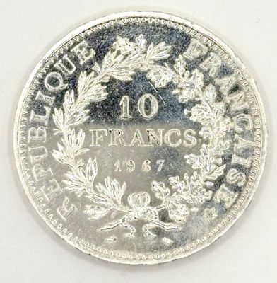 a close up of a coin on a white surface