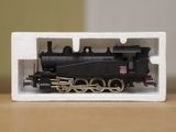 a small model of a train sitting on a table