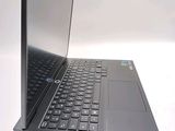 a laptop that is open on a white surface