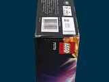 a box of legos sitting on a blue surface
