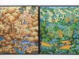 Deux tableaux représentant une forêt et une rivière sont accrochés au mur.