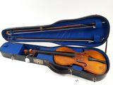 a violin in a case with a bow in it