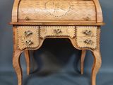 an image of a small wooden desk with a clock on it