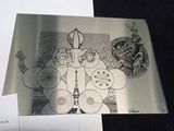a black and white photo of a drawing on a piece of paper with a picture of the eiffel tower in the background