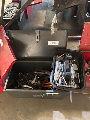 a dog that is standing next to a tool box