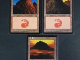 three cards with a picture of a mountain in the middle of them