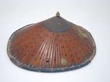 a red and blue hat with a metal handle
