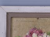 a picture of a painting of flowers in a white frame