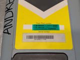 a close up of a cell phone with a sticker on it