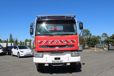 a red and white truck parked in a parking lot