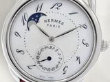 a close up of a wrist watch with a moon on it