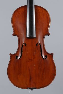 a violin with a bow on a stand on a gray background