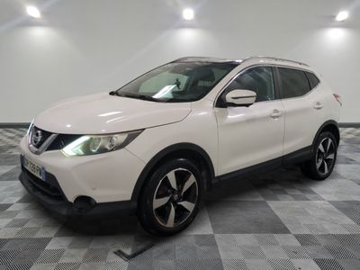 the white nissan suv is parked on a checkered floor
