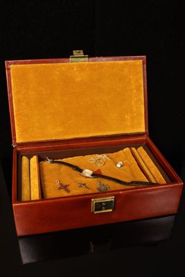 an image of a wooden box with a set of items in it